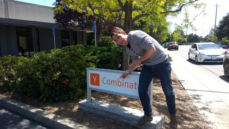 A Go1 founder at the Y Combinator sign